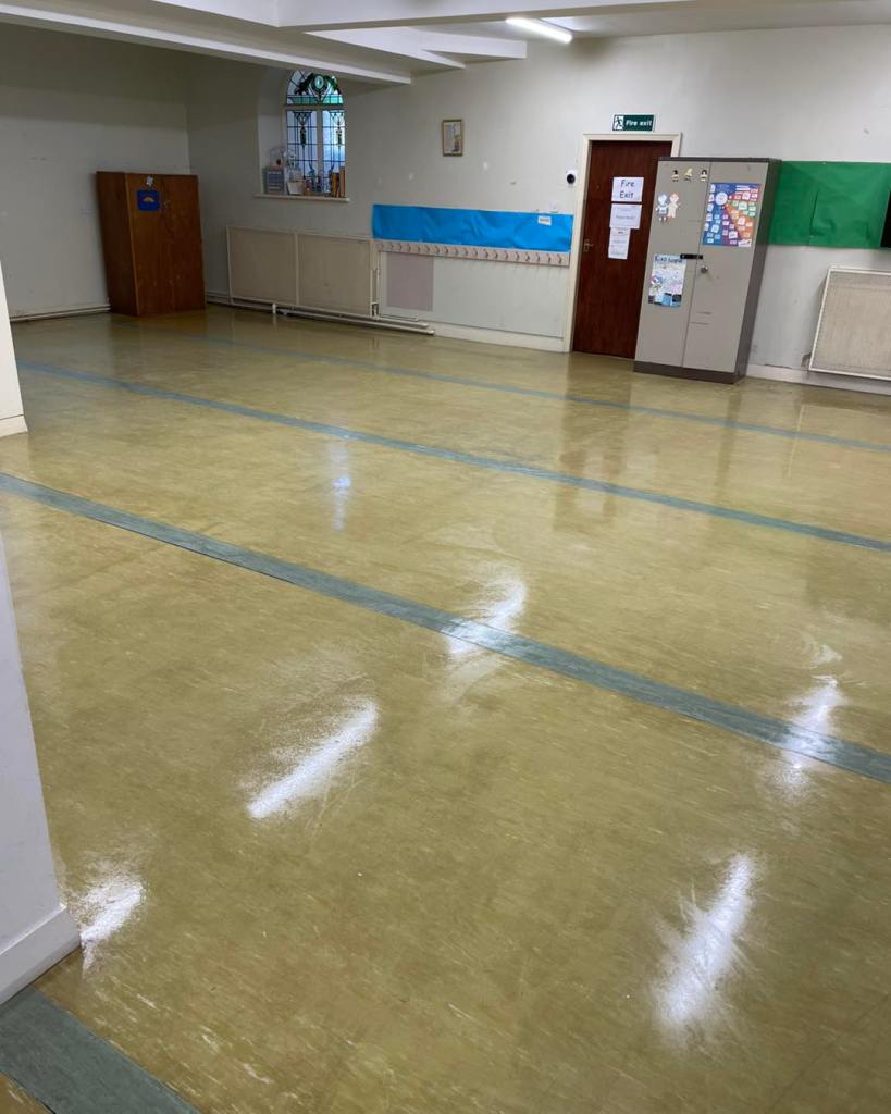 large hard floor area in a school shining from polish