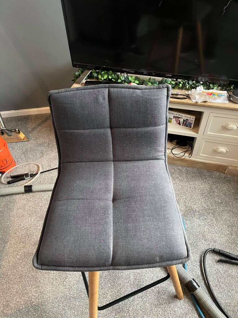 grey fabric dining chair showing marks no longer visible after cleaning